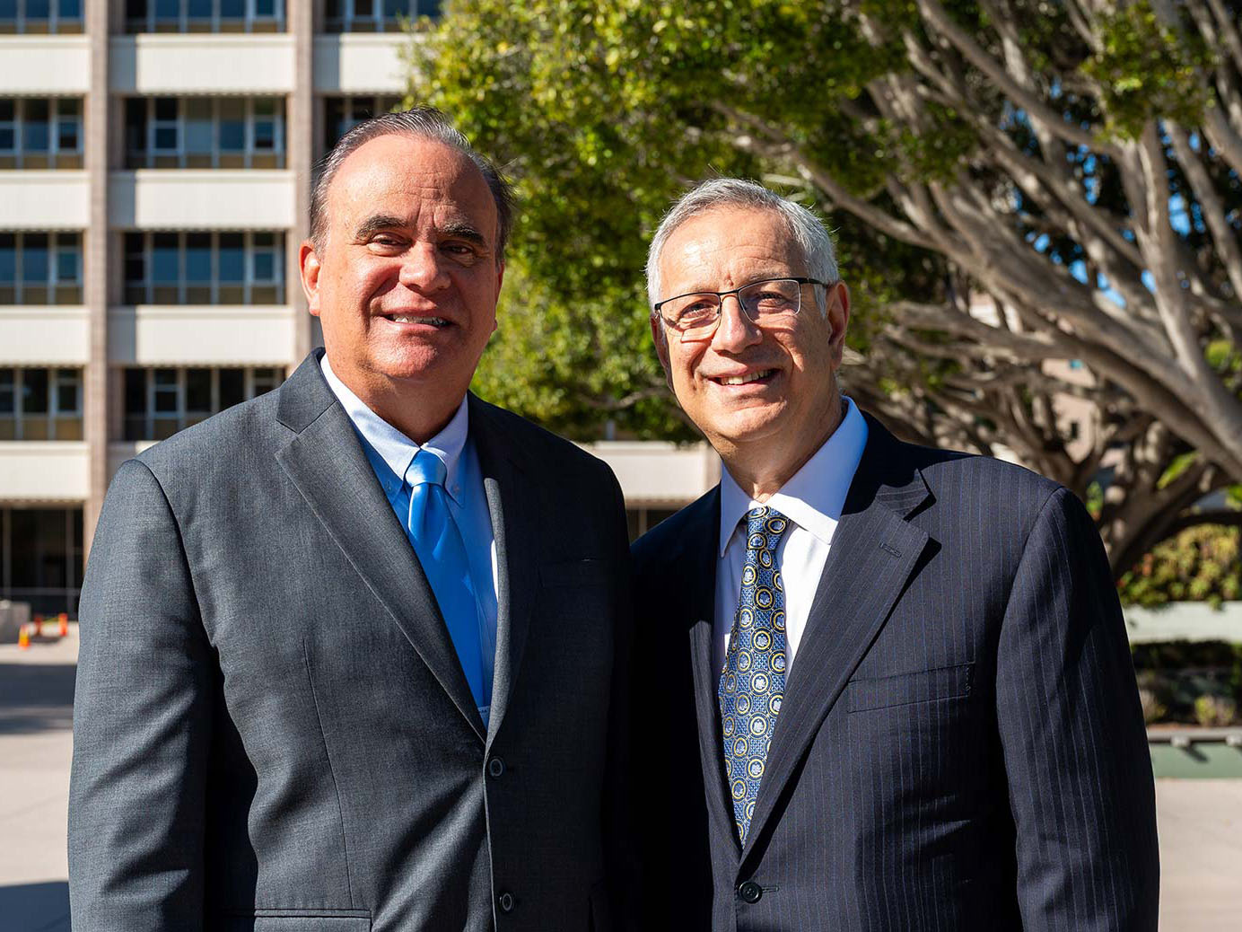 Professor Steven DenBaars with Chancellor Dennis Assanis outside on UCSB campus.
